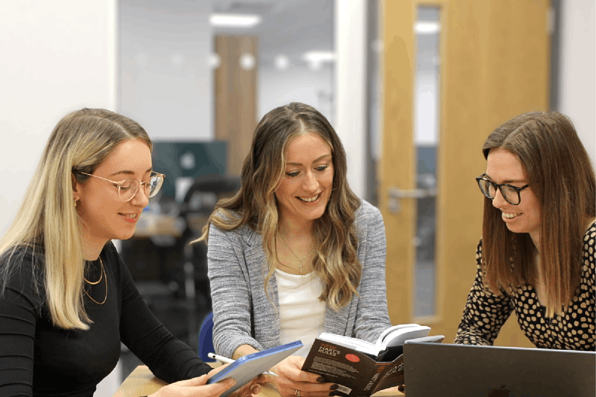 Libero editors reviewing a manuscript together
